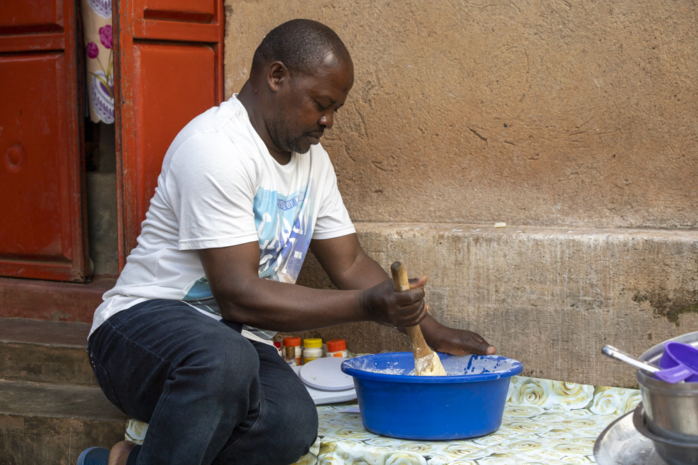 Men working on a cake dough.